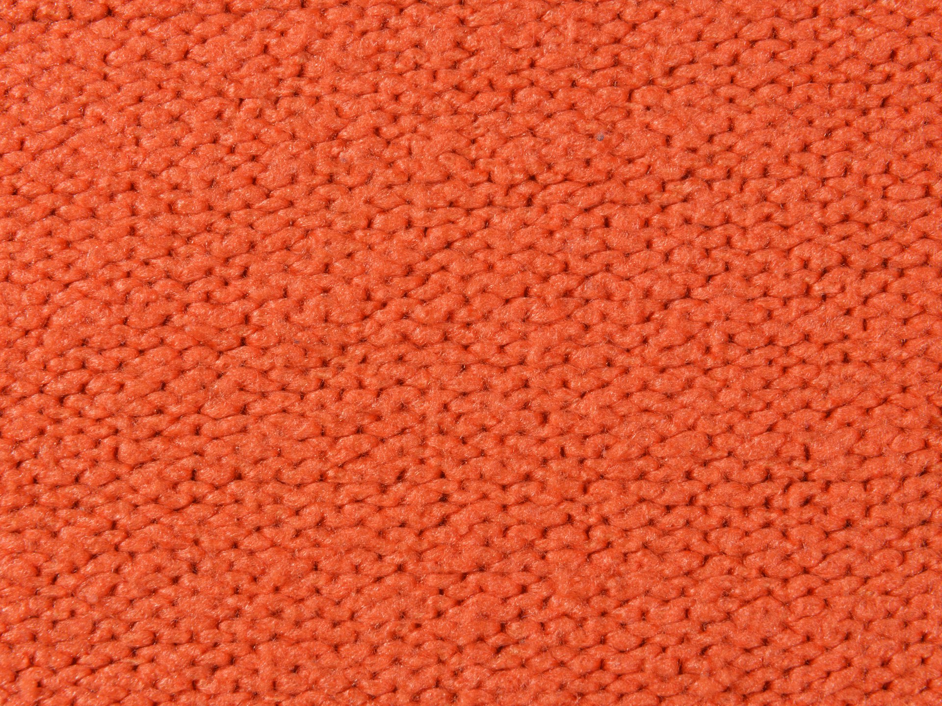 a close up of an orange carpet texture